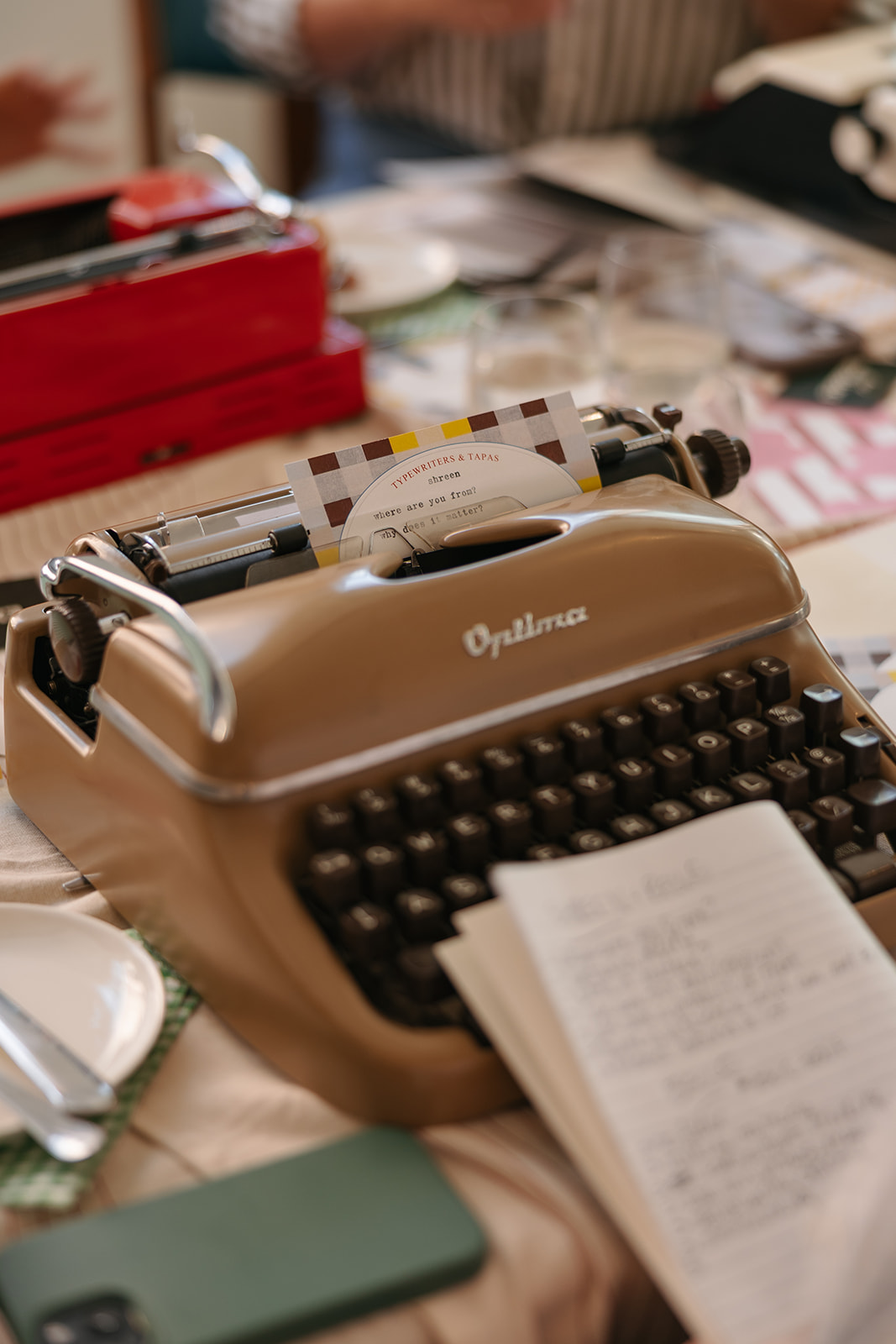 Participants writing poems on vintage typewriters at a New Year workshop in Toronto